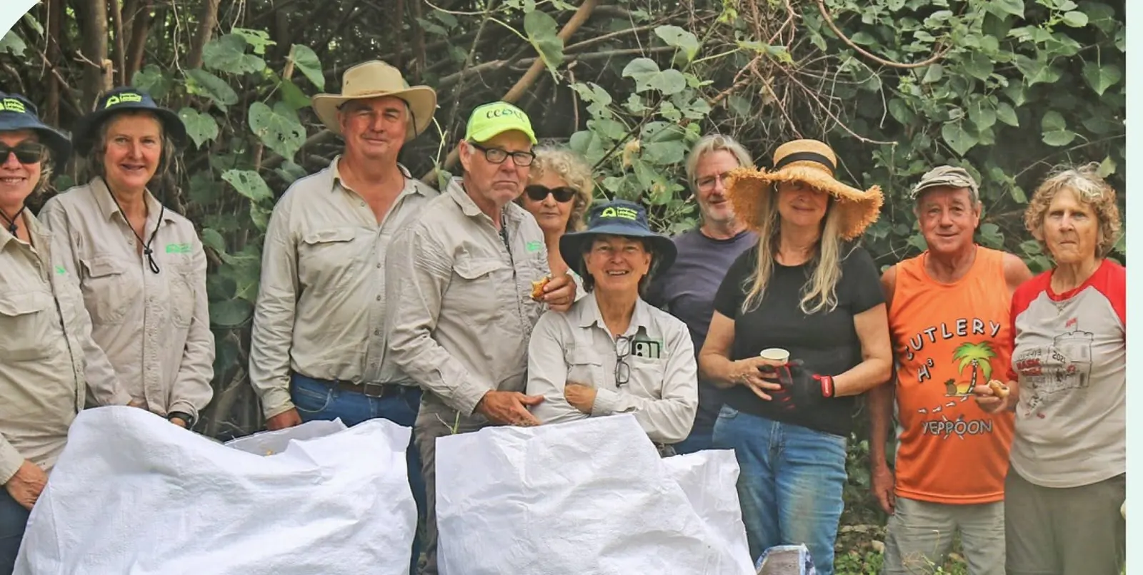 Capricorn Coast Landcare Group volunteers with bags of collected containers